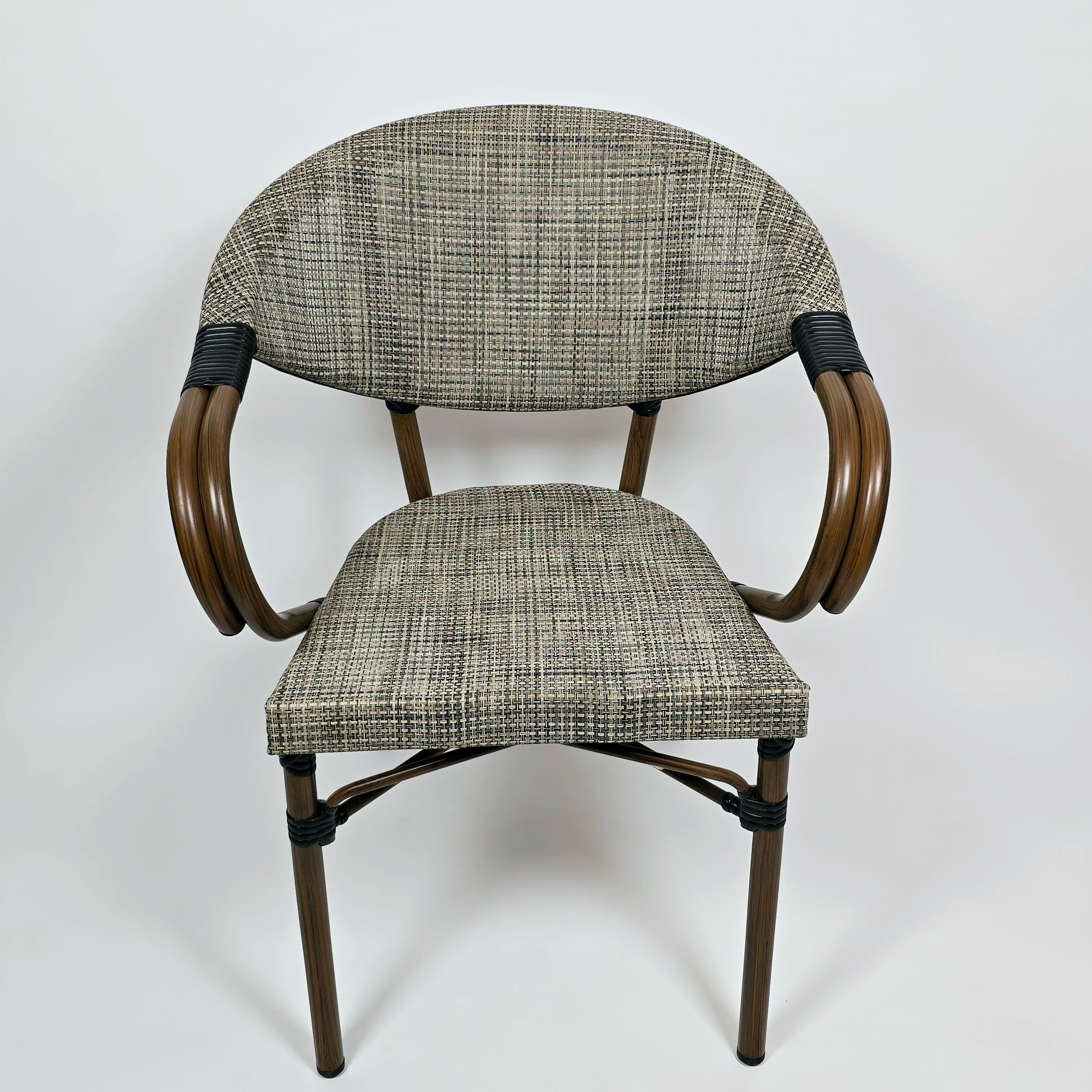 The chair is made of iron with an elegant design,