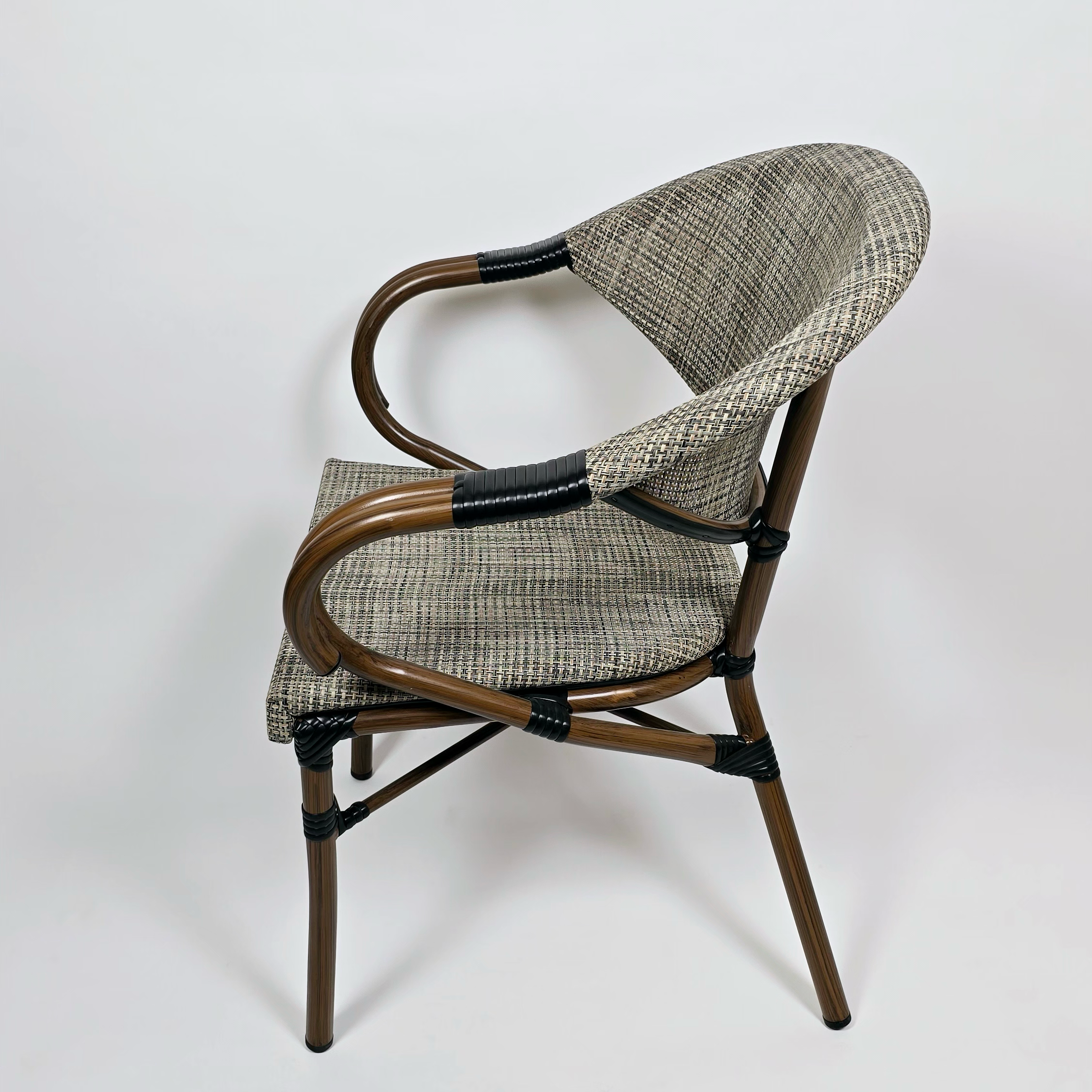 The chair is made of iron with an elegant design,